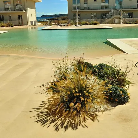 Апартаменты Borgo 84 Olimpia Con Piscina Fronte Mare